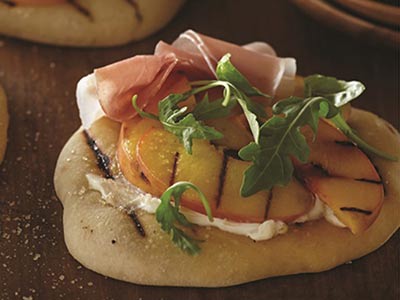 Pizza with Grilled Peaches and Prosciutto